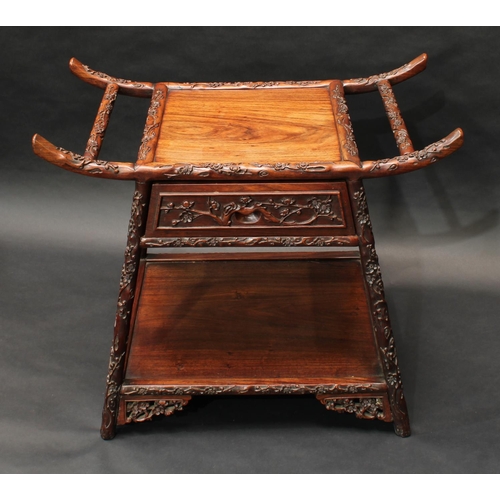 1428 - A Chinese hardwood pagoda shaped stool, panel seat above a frieze drawer, carved throughout with blo... 