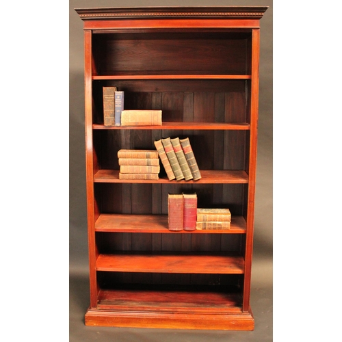 1461 - A 'Edwardian' walnut open bookcase, dentil cornice above adjustable shelves, plinth base, 208cm high... 