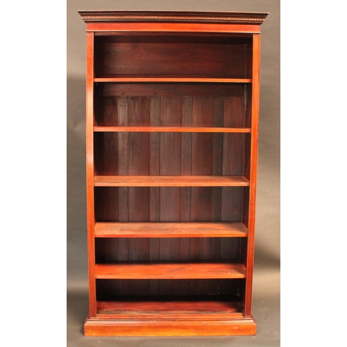 1461 - A 'Edwardian' walnut open bookcase, dentil cornice above adjustable shelves, plinth base, 208cm high... 