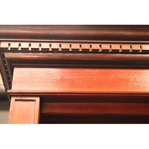 1461 - A 'Edwardian' walnut open bookcase, dentil cornice above adjustable shelves, plinth base, 208cm high... 