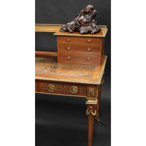 1464 - A Franglias Louis XVI Revival gilt metal mounted mahogany desk, inverted break-centre superstructure... 