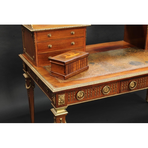 1464 - A Franglias Louis XVI Revival gilt metal mounted mahogany desk, inverted break-centre superstructure... 