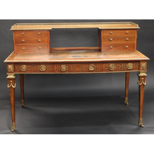 1464 - A Franglias Louis XVI Revival gilt metal mounted mahogany desk, inverted break-centre superstructure... 