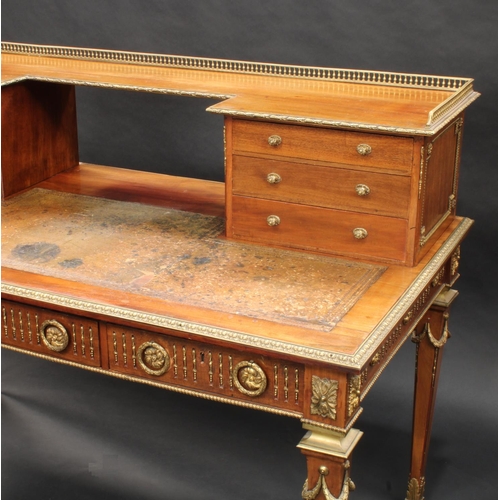 1464 - A Franglias Louis XVI Revival gilt metal mounted mahogany desk, inverted break-centre superstructure... 