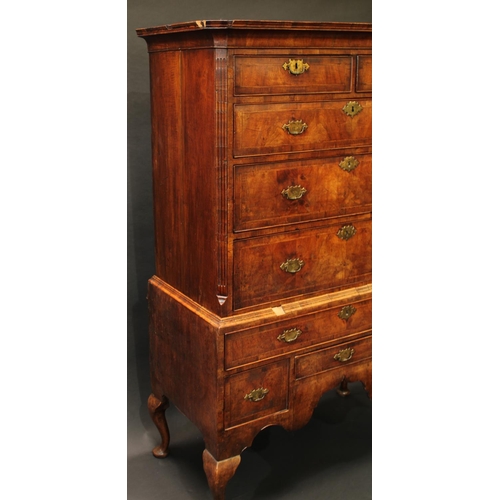 1475 - A George I walnut chest on stand, concave moulded outswept cornice above two short and three long gr... 