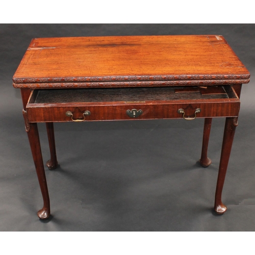 1481 - A 'George II' mahogany concertina action card table, folding top with carved edge enclosing an inset... 