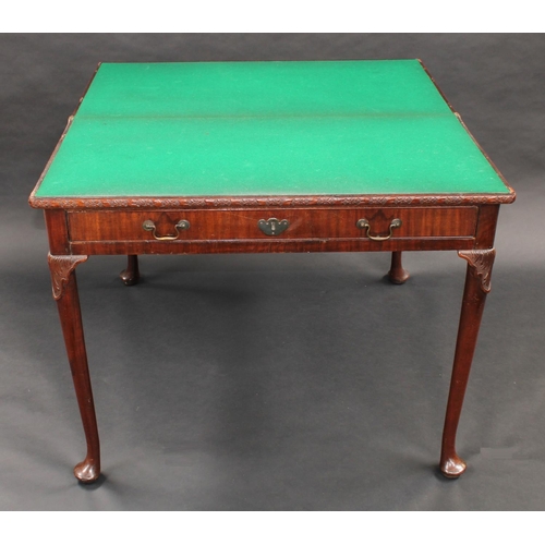 1481 - A 'George II' mahogany concertina action card table, folding top with carved edge enclosing an inset... 