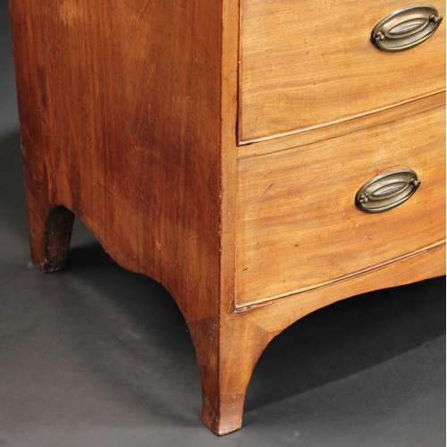 1502 - A George III mahogany bow fronted chest, of three long graduated cockbeaded drawers, crossbanded top... 