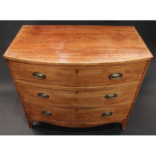 1502 - A George III mahogany bow fronted chest, of three long graduated cockbeaded drawers, crossbanded top... 