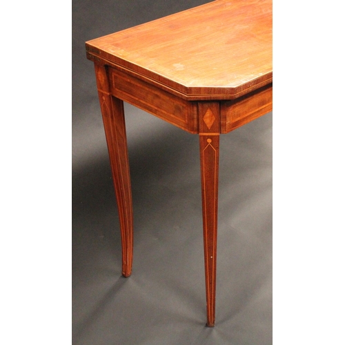 1505 - A George III mahogany canted rectangular card table, folding crossbanded top enclosing an inset baiz... 