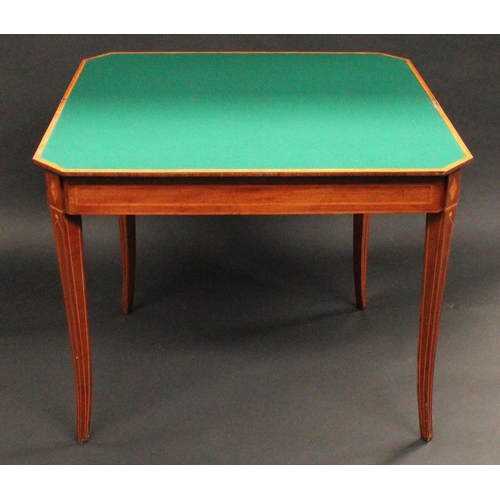 1505 - A George III mahogany canted rectangular card table, folding crossbanded top enclosing an inset baiz... 