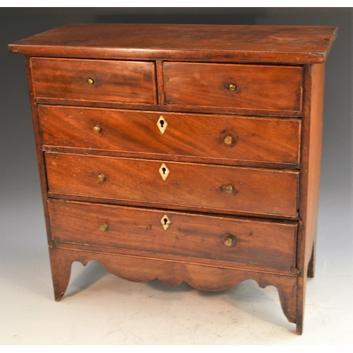 1512 - A George III mahogany miniature chest of drawers, oversailing top above two short and three long gra... 