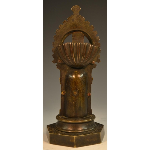 1571 - A Gothic Revival dark patinated bronze pocket watch stand, cast with a chivalric knight within a nic... 