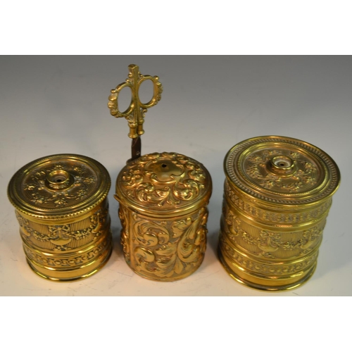 1596 - A late 19th century brass cylindrical string box, repousse embossed with scrolling  acanthus, scisso... 