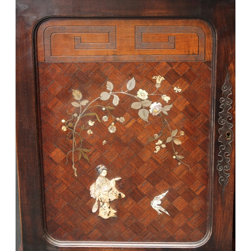 1599 - A late 19th century marquetry and shibayama vitrine 'shodhana', crested by a boldly carved ferocious... 