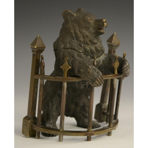 1601 - A late 19th century Russian bronze inkwell, as a bear,  standing on his hind legs, behind semi-circu... 