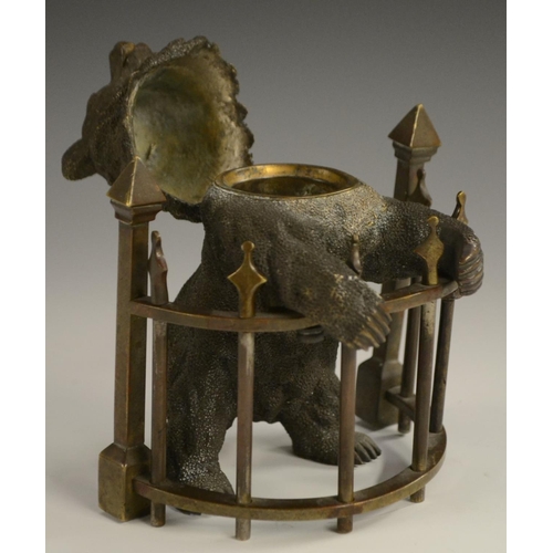 1601 - A late 19th century Russian bronze inkwell, as a bear,  standing on his hind legs, behind semi-circu... 