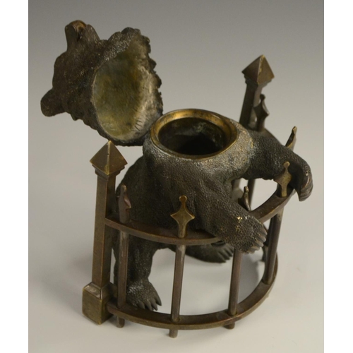 1601 - A late 19th century Russian bronze inkwell, as a bear,  standing on his hind legs, behind semi-circu... 