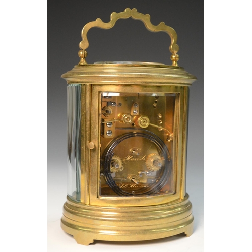 1603 - A late 19th/early 20th century gilt metal and enamelled oval repeater carriage clock, enamelled with... 