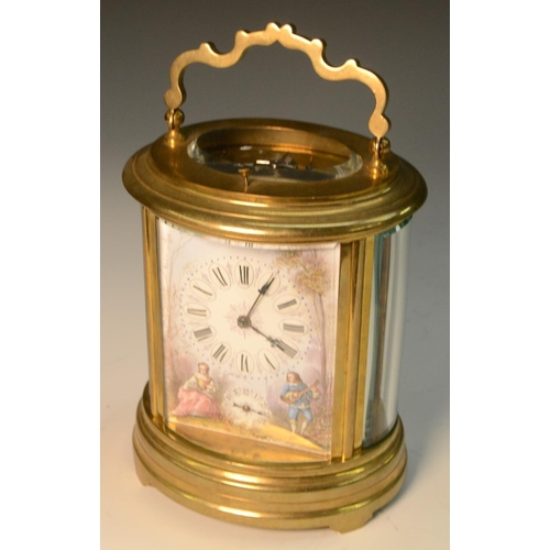 1603 - A late 19th/early 20th century gilt metal and enamelled oval repeater carriage clock, enamelled with... 