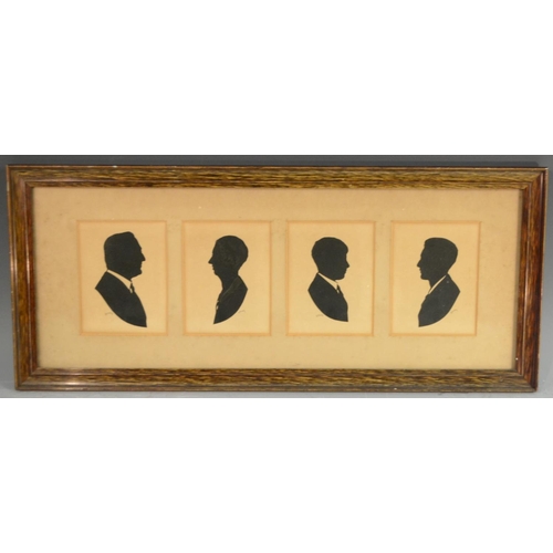 1623 - A mid 20th century family group of silhouettes, The Ayre Family, Ernest, Eva and two sons, Charles a... 