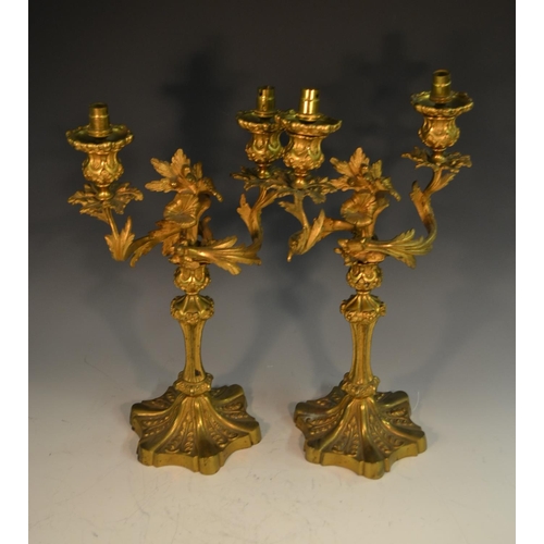 1657 - A pair of 19th century ormolu two-light table candlesticks, cast with leafy scrolls, fluted columns,... 