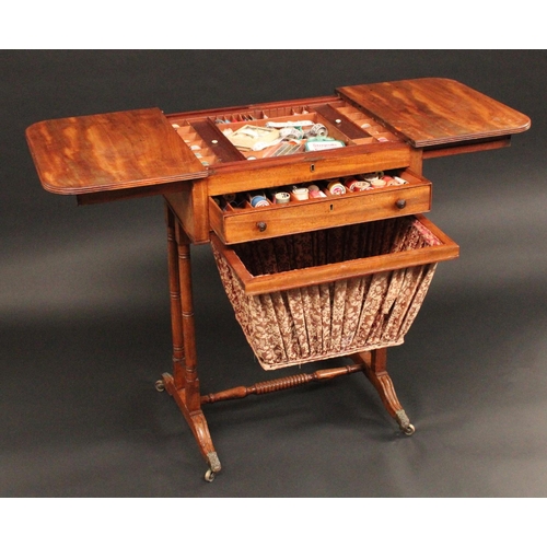 1705 - A Regency mahogany rounded rectangular work table, the sliding reeded top parting to reveal an arran... 