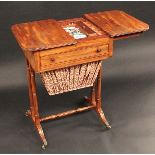 1705 - A Regency mahogany rounded rectangular work table, the sliding reeded top parting to reveal an arran... 