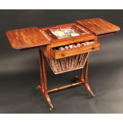 1705 - A Regency mahogany rounded rectangular work table, the sliding reeded top parting to reveal an arran... 