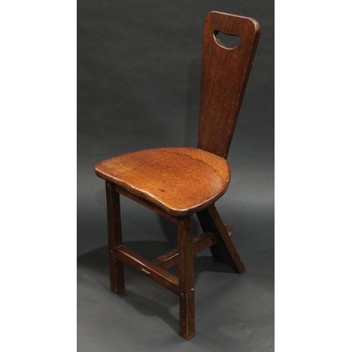 1726 - A set of six oak chairs, each with hand hole, shaped seats, T stretchers, carved with a beetle, mid ... 