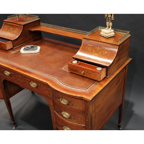 1734 - A Sheraton Revival satinwood crossbanded mahogany and marquetry writing desk, the inverted break-cen... 