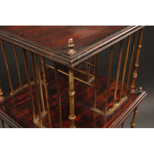 1747 - A Victorian Aesthetic Movement oak and brass revolving bookcase, moulded rectangular plateaux, turne... 