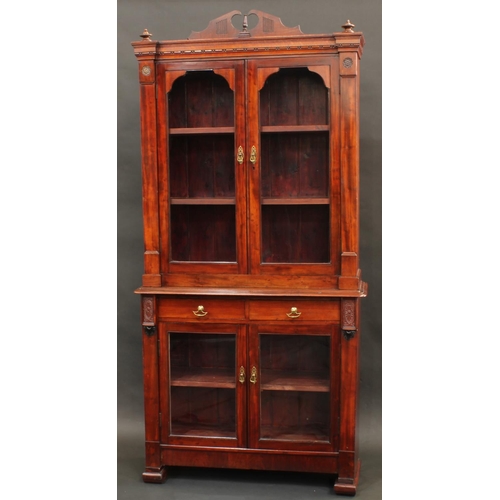 1762 - A 'Victorian' mahogany and oak library bookcase, shaped pediment above a pair of glazed doors, the p... 