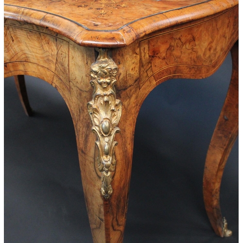 1766 - A Victorian gilt metal mounted burr walnut and marquetry shaped rectangular occasional writing table... 