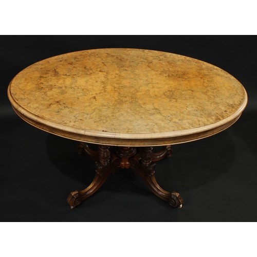 1770 - A Victorian burr walnut breakfast table, oval tilting top, quad-column base with turned and fluted p... 