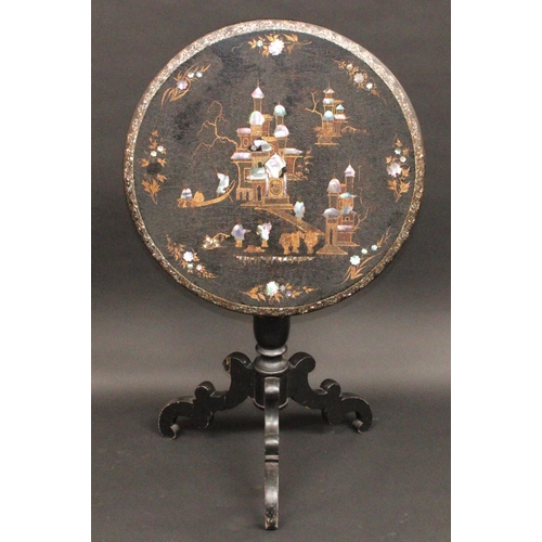 1775 - A Victorian Japanned tripod occasional table, tilt top inlaid with mother-of-pearl and gilt in the C... 