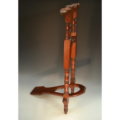 1779 - A Victorian mahogany country house boot jack, turned handle and frame, 85cm long, c.1880