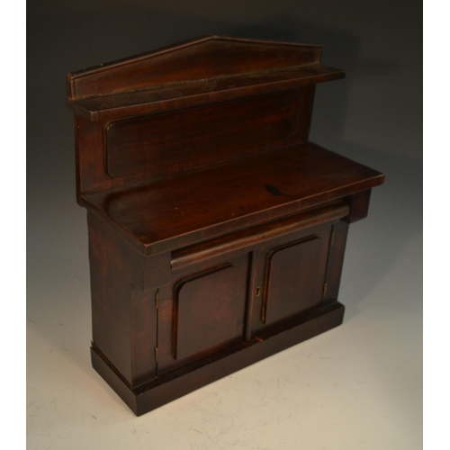 1783 - A Victorian mahogany miniature chiffonier, pointed arched back with open shelf, cushion moulded frie... 