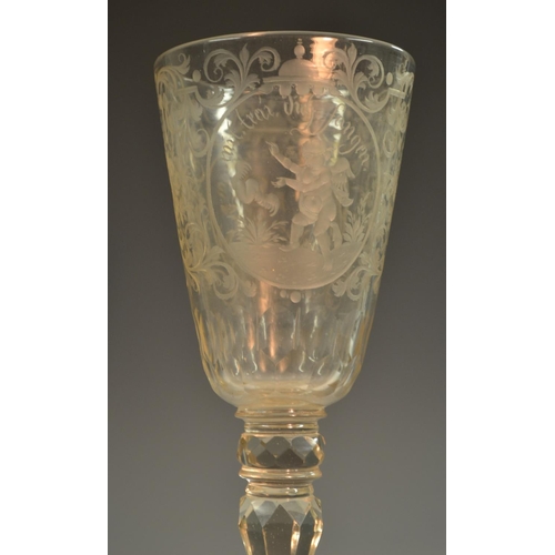 191 - A 19th century Bohemain glass goblet, etched and engraved with roundels of amorini, each enclosing a... 