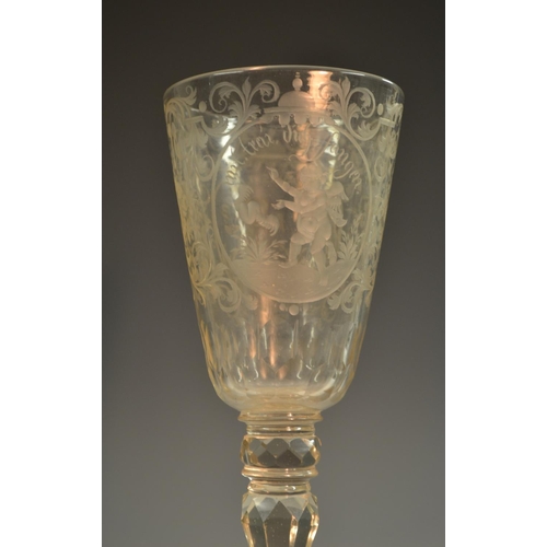 193 - A 19th century Bohemian glass armorial pedestal goblet and cover, the fluted tapering bowl boldly et... 