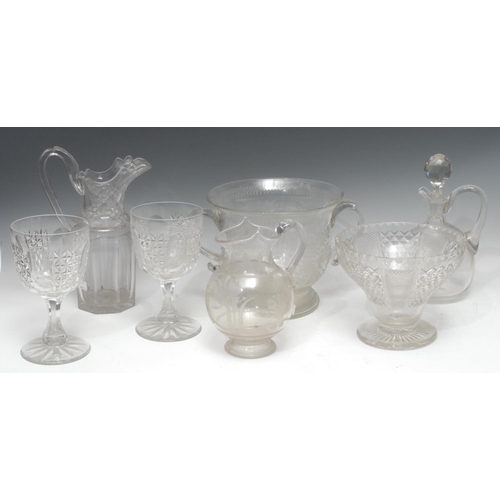 195 - A 19th century clear glass two-handled loving cup, engraved with scrolling foliage, S scroll handles... 