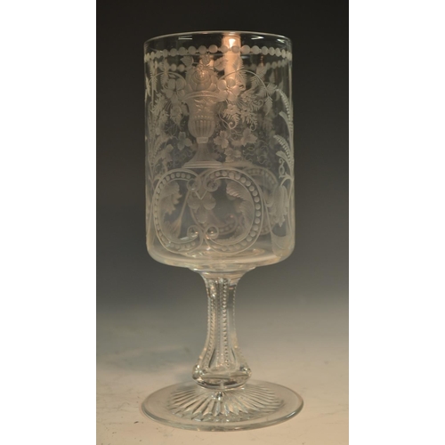 196 - A 19th century Continental glass, probably German, the cylinder bowl well-engraved with flowering ur... 