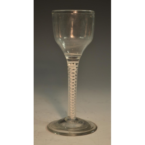 201 - A George III opaque twist wine glass, ogee-shaped bowl, double-helix stem, domed foot, slight pontil... 