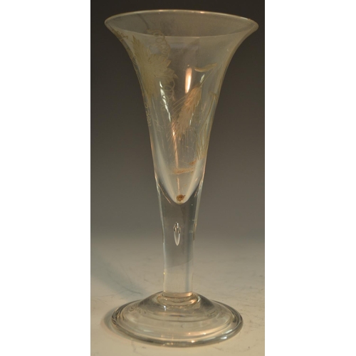 206 - A large George III ale glass, the trumpet-shaped bowl etched and engraved with hops, domed foot, sli... 