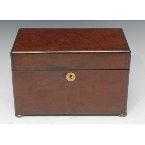 2061 - A Victorian mahogany rounded rectangular tea caddy, quite plain, the hinged cover enclosing a covere... 