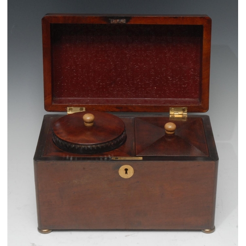 2061 - A Victorian mahogany rounded rectangular tea caddy, quite plain, the hinged cover enclosing a covere... 