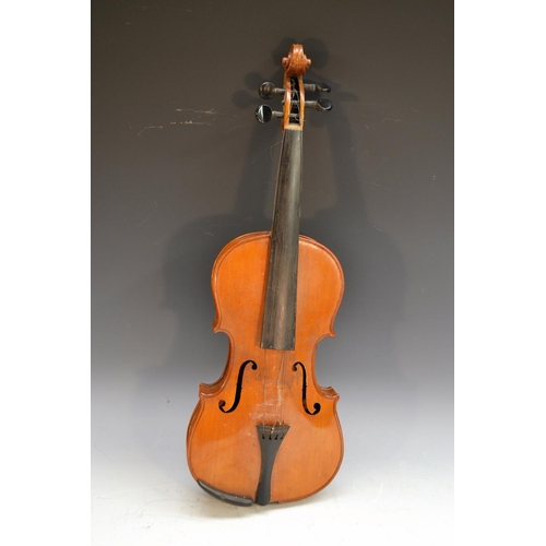 2064 - A violin, the two-piece back 35.5cm long excluding button, stamped Patent No. 23140, outlined throug... 