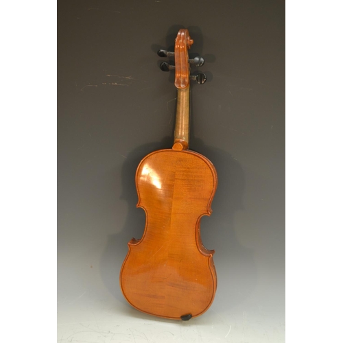 2064 - A violin, the two-piece back 35.5cm long excluding button, stamped Patent No. 23140, outlined throug... 