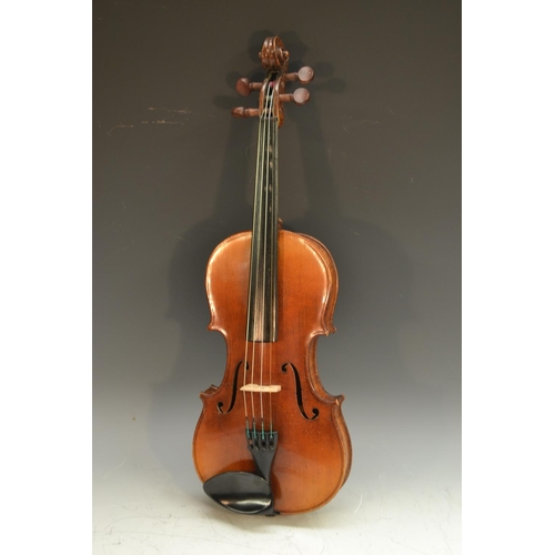 2065 - A violin, the two-piece back 36cm long excluding button, outlined throughout with purfling, paper St... 