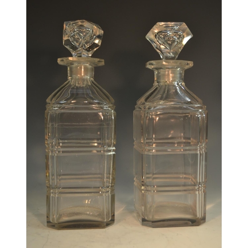 213 - A pair of 19th century glass square decanters, each fluted with girdles, panelled shoulders, prismat... 